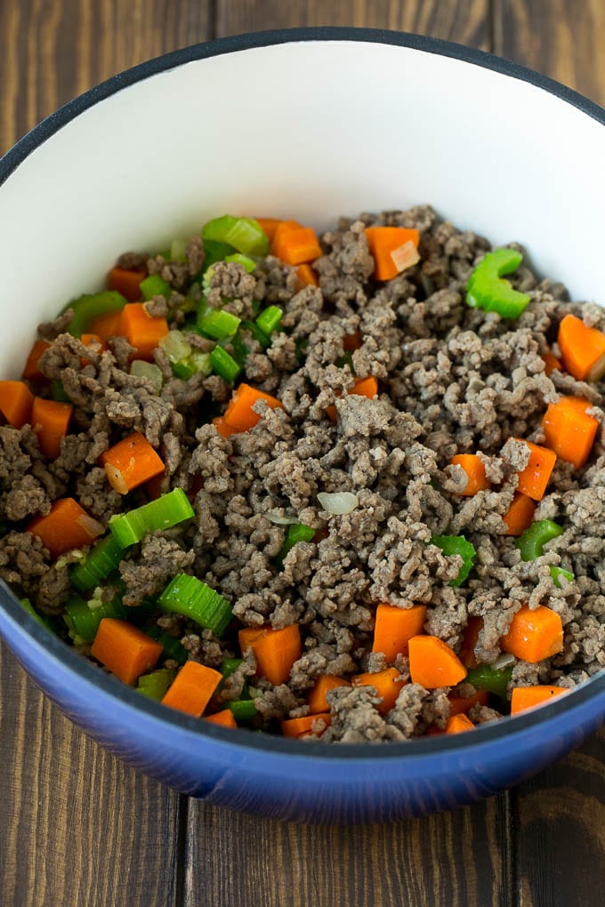 Ground beef, carrots, onion and celery in a soup pot.