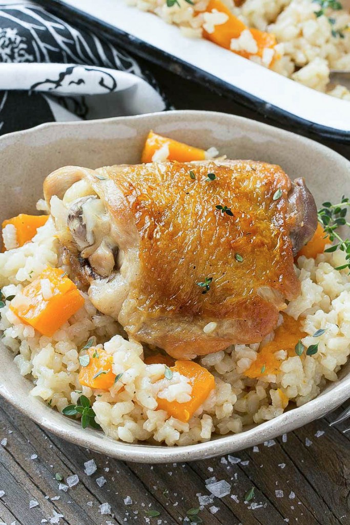 This One Pot Oven Chicken and Rice Bake combines chicken with creamy parmesan rice and butternut squash for a complete healthy meal with less dishes to clean.