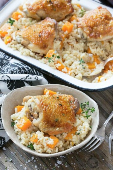 This One Pot Oven Chicken and Rice Bake combines chicken with creamy parmesan rice and butternut squash for a complete healthy meal with less dishes to clean.