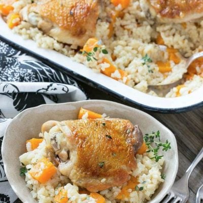 This One Pot Oven Chicken and Rice Bake combines chicken with creamy parmesan rice and butternut squash for a complete healthy meal with less dishes to clean.