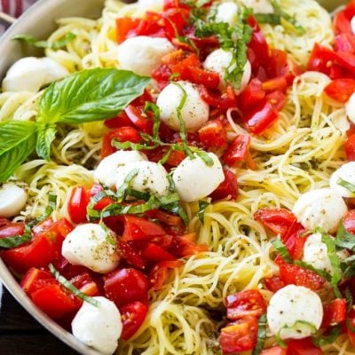 Caprese pasta with fresh diced tomatoes, mozzarella balls and thinly sliced basil.