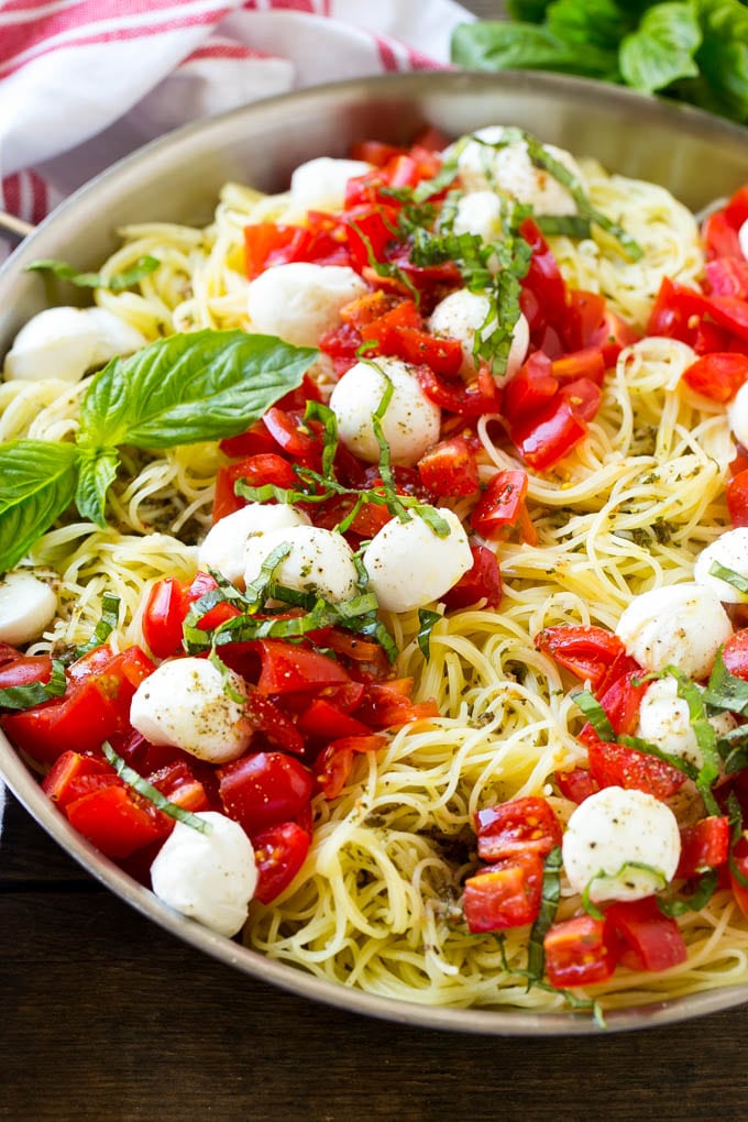 Caprese pasta with fresh diced tomatoes, mozzarella balls and thinly sliced basil.