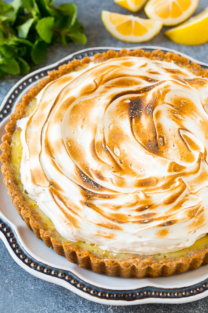 A lemon meringue tart topped with toasted brown sugar meringue.