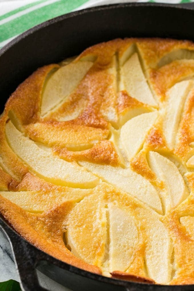 A baked pear dessert made with sliced fruit and custard.
