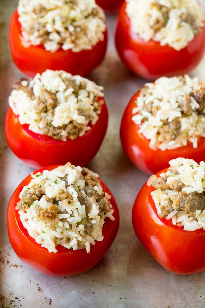 Hollowed out tomatoes stuffed with sausage and rice.