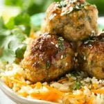 This recipe for asian turkey meatballs involves light and tender meatballs that are seasoned with asian flavors, tossed in a honey garlic sauce and served over a colorful carrot rice. It's a quick and easy weeknight meal that the whole family will love!