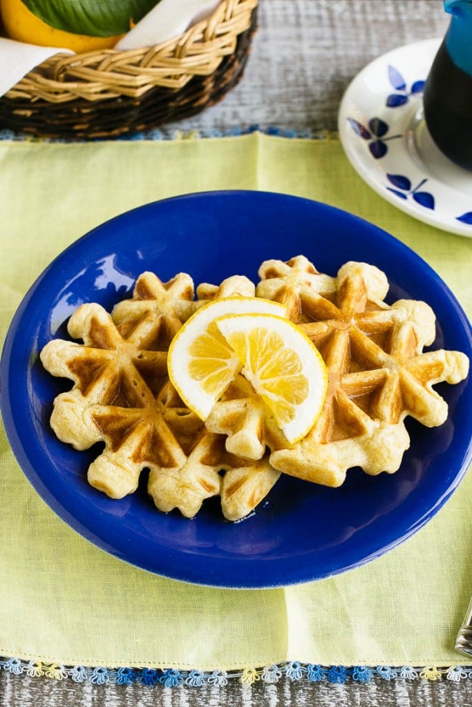 This recipe for lemon waffles made with sour cream are light and fluffy with the perfect amount of tang. Serve these waffles with maple syrup or lemon curd for the perfect weekend breakfast!