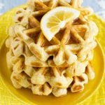 This recipe for lemon waffles made with sour cream are light and fluffy with the perfect amount of tang. Serve these waffles with maple syrup or lemon curd for the perfect weekend breakfast!