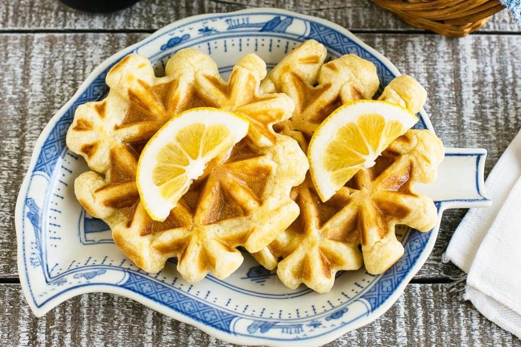 This recipe for lemon waffles made with sour cream are light and fluffy with the perfect amount of tang. Serve these waffles with maple syrup or lemon curd for the perfect weekend breakfast!