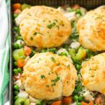 This recipe for biscuit chicken pot pie is a creamy mixture of seasoned chicken, vegetables and herbs that's been topped with flaky cheddar biscuits and baked to perfection.
