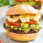 This recipe is for a black bean veggie burger with a Mexican twist! The veggie patty is layered with southwestern sauce, grilled corn, guacamole, cheese and tomatoes to create a hearty vegetarian sandwich.