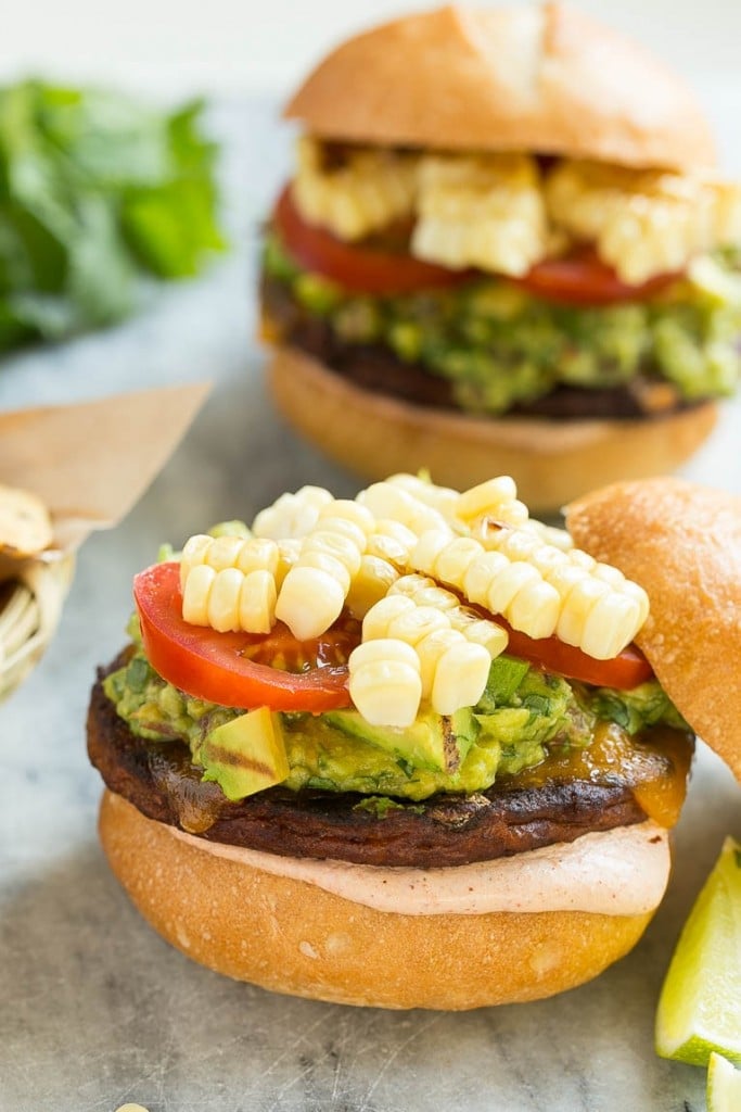 This recipe is for a black bean veggie burger with a Mexican twist! The veggie patty is layered with southwestern sauce, grilled corn, guacamole, cheese and tomatoes to create a hearty vegetarian sandwich.