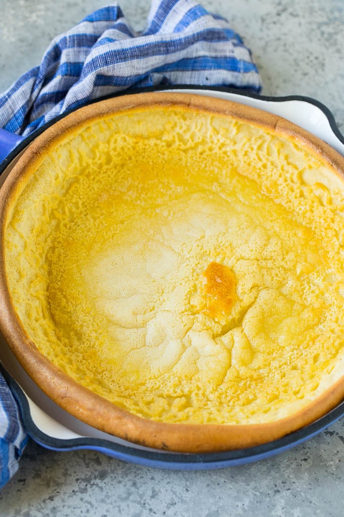 A puffed pancake in a skillet.