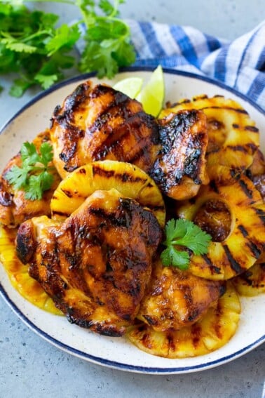 A plate of Hawaiian chicken with grilled pineapple.