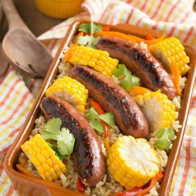 This sausage and rice bake is full of summer vegetables and is a complete meal in one pot!