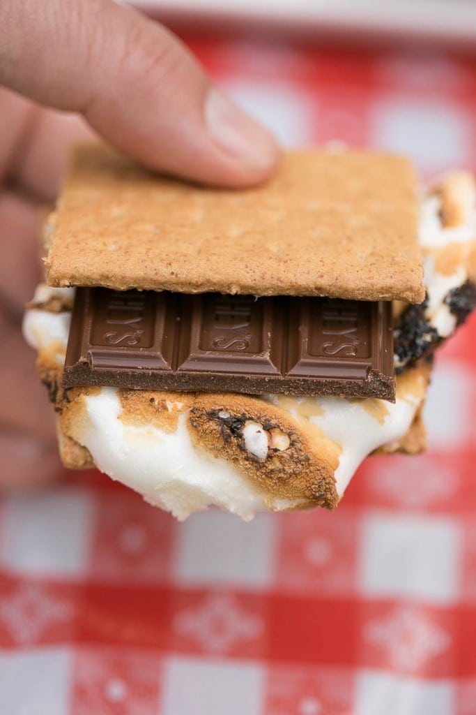 How to throw an amazing summer S'mores bar party plus a recipe for strawberry banana S'mores. Ad
