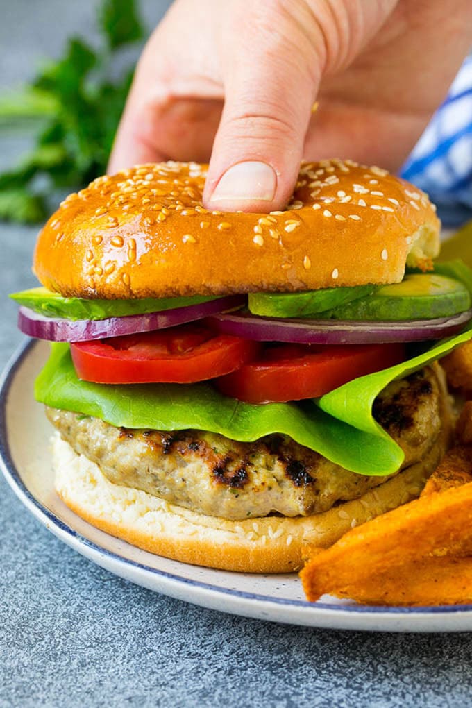 The best turkey burgers topped with lettuce, tomato, red onion and avocado.