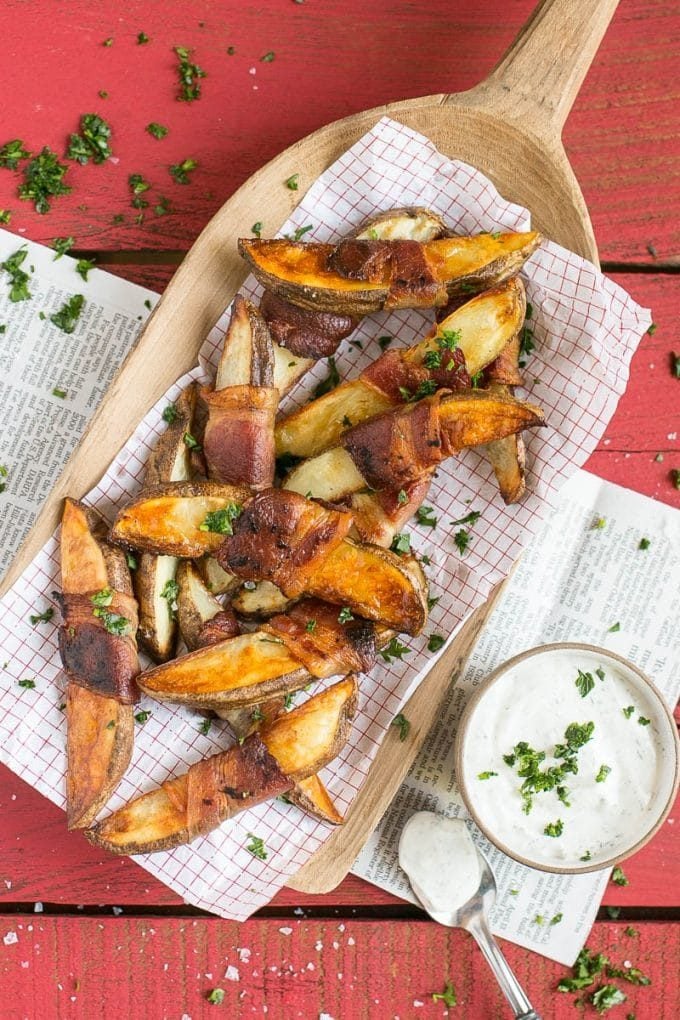 Potato wedges wrapped in bacon and served with ranch dip.