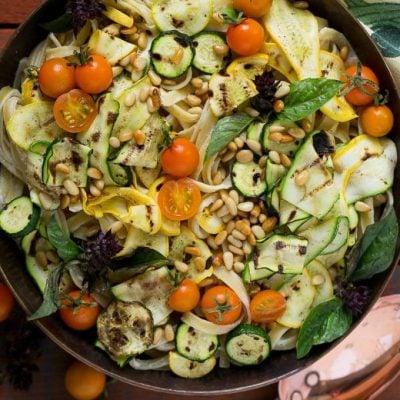 This zucchini fettuccine alfredo features a healthier remake of the classic sauce (no cream!) with the addition of grilled zucchini, cherry tomatoes and pine nuts.