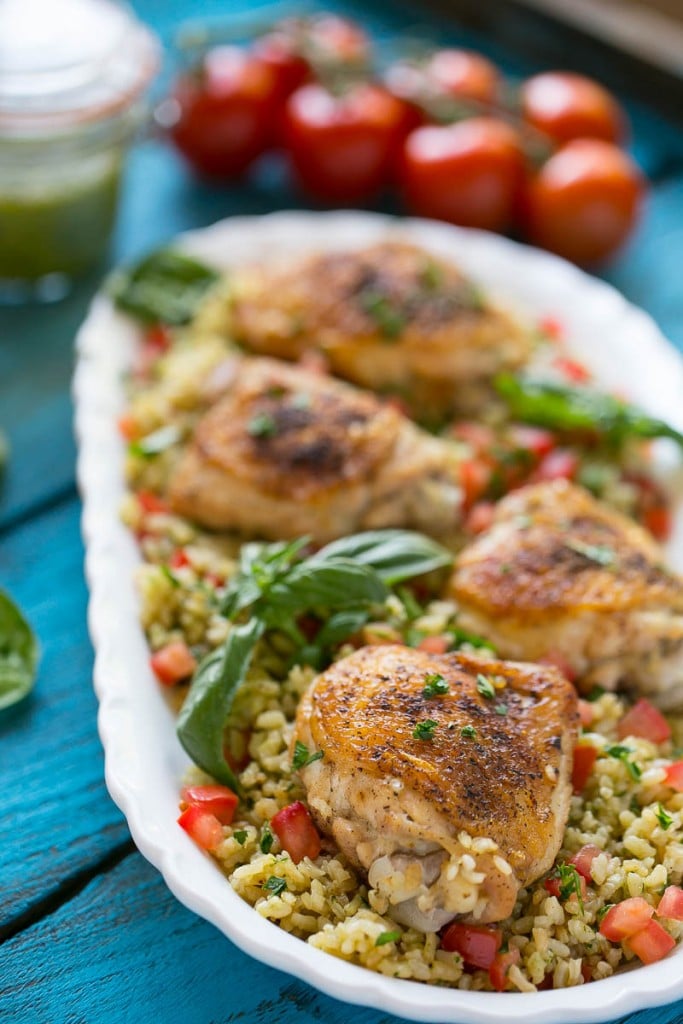 This one pot chicken with tomato basil risotto is the perfect weeknight meal - the whole thing bakes in the oven in a single dish!