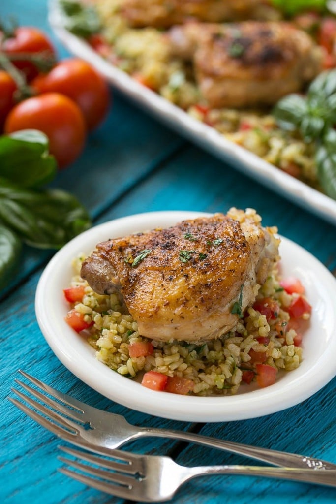 This one pot chicken with tomato basil risotto is the perfect weeknight meal - the whole thing bakes in the oven in a single dish!