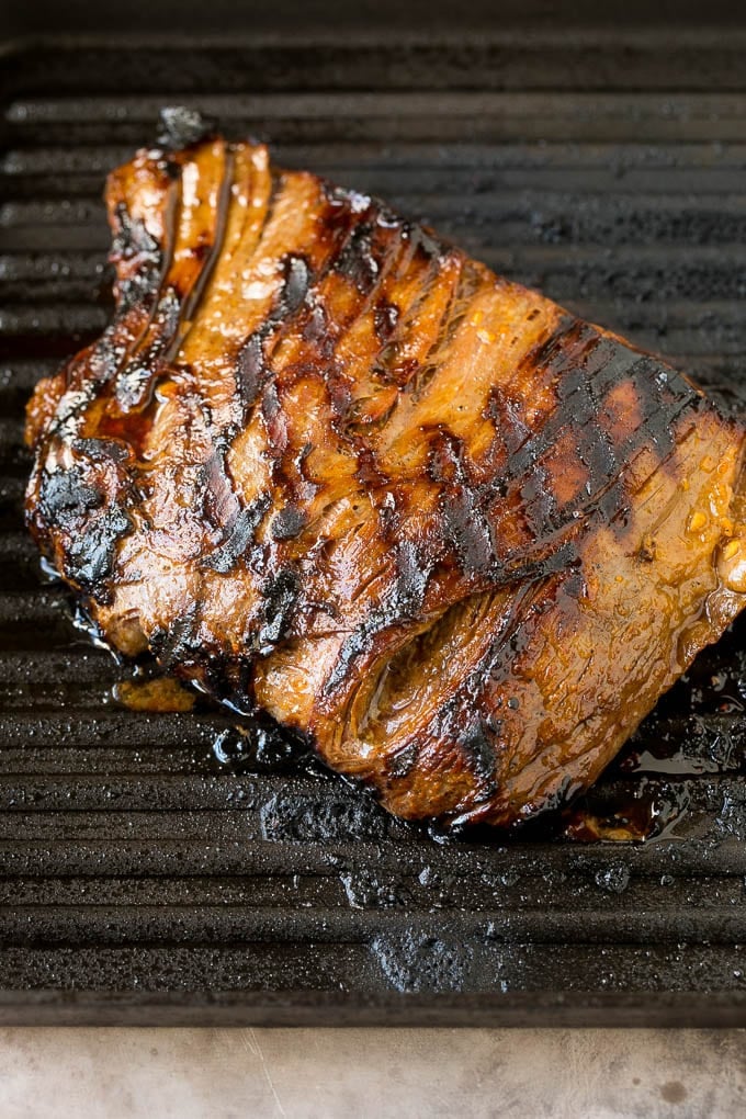 Flank steak cooked on a grill pan.
