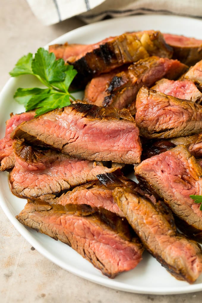 Flank steak marinade flavored meat that's been thinly sliced.