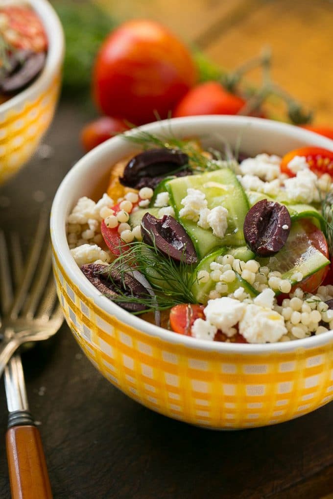 Greek couscous topped with vegetables and feta cheese.