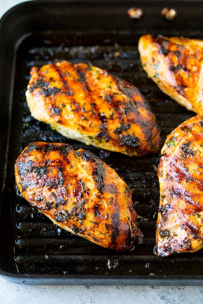 Chicken breasts cooked on a grill pan.