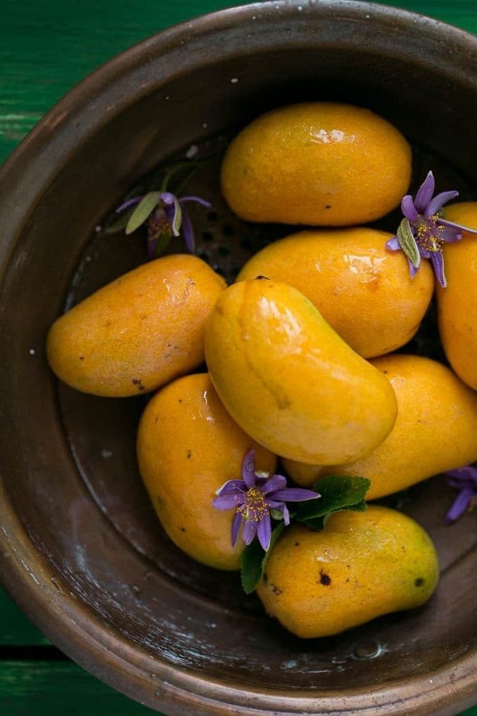 Mangoes in a colander.