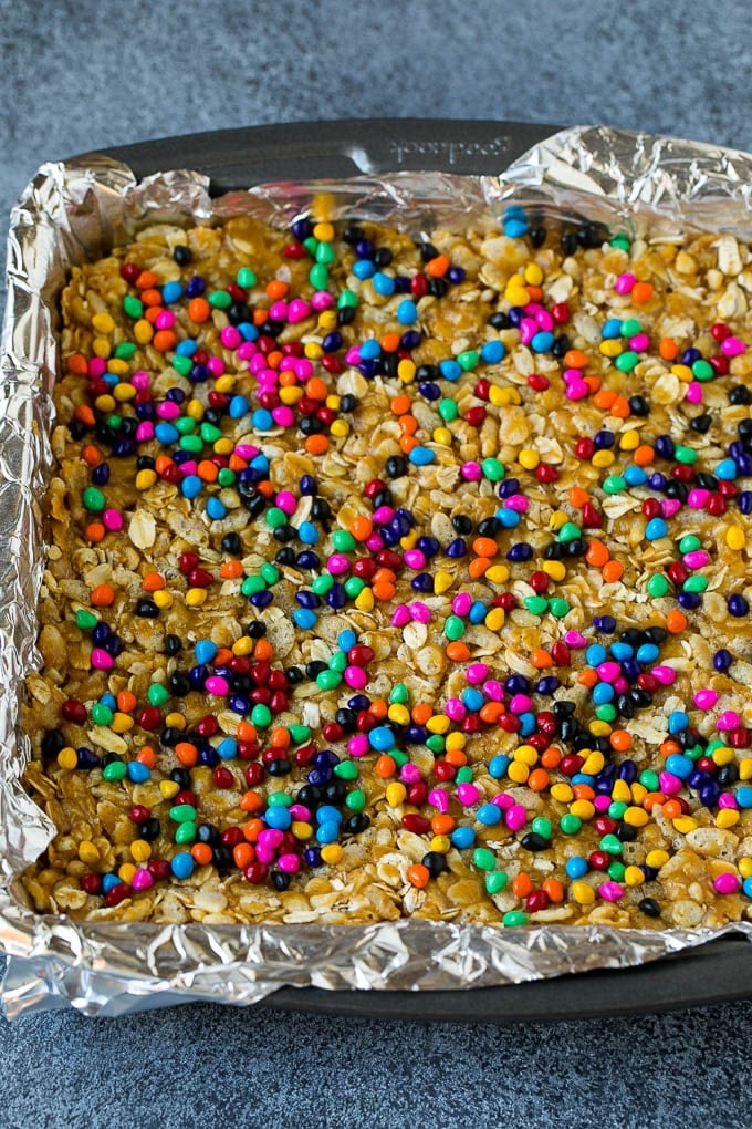 A square pan filled with a peanut butter and cereal mixture.