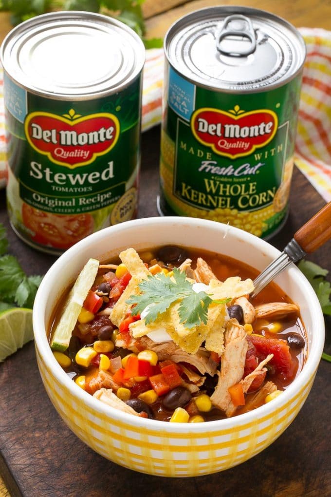 Chicken taco soup ingredients and a bowl of soup. 