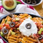 Waffle fries are smothered in nacho toppings for a fun and delicious snack. #FarmtoFlavor Ad