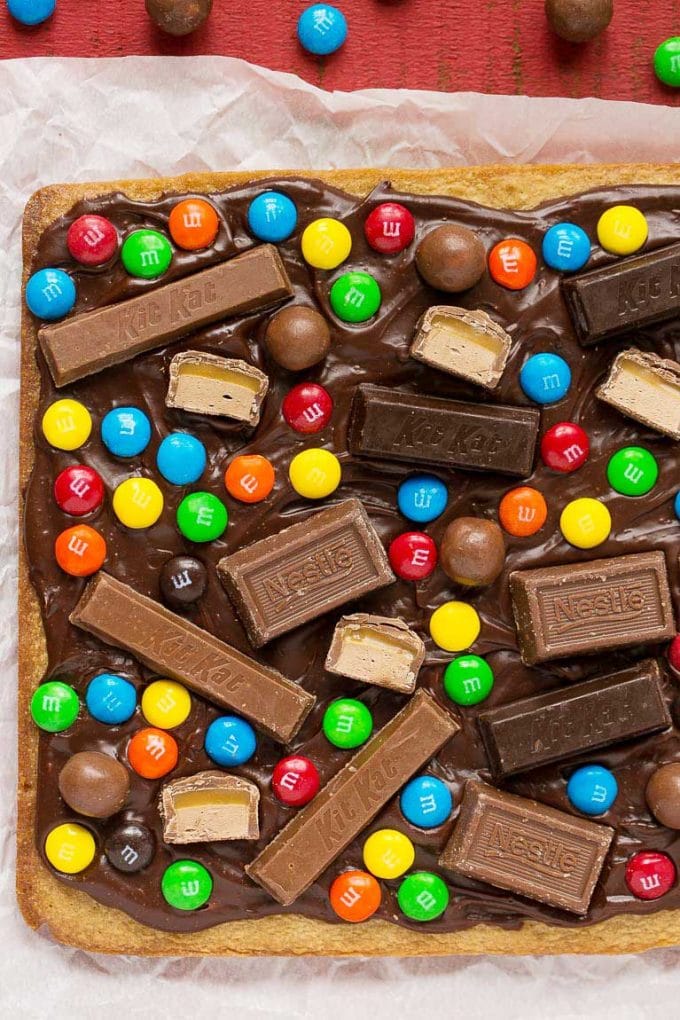 An uncut slab of chocolate covered dessert bars.