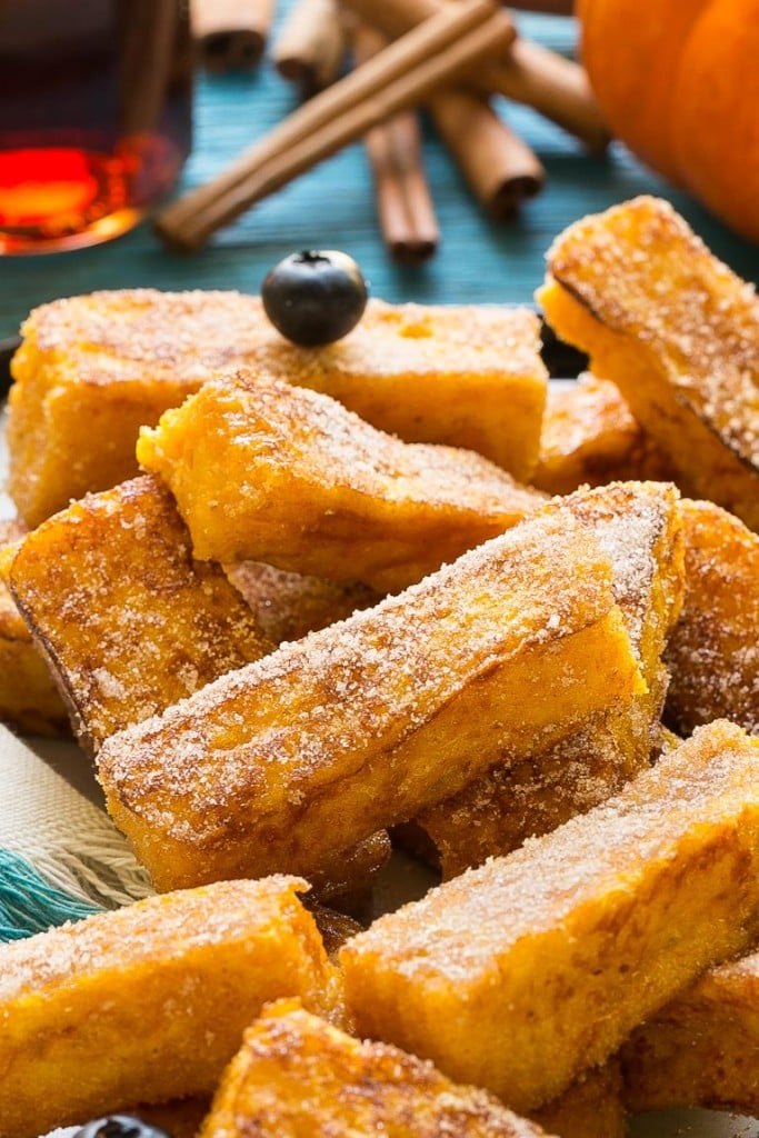 Light and fluffy pumpkin french toast sticks coated in cinnamon sugar. They're super fun to eat and they taste like a churro!