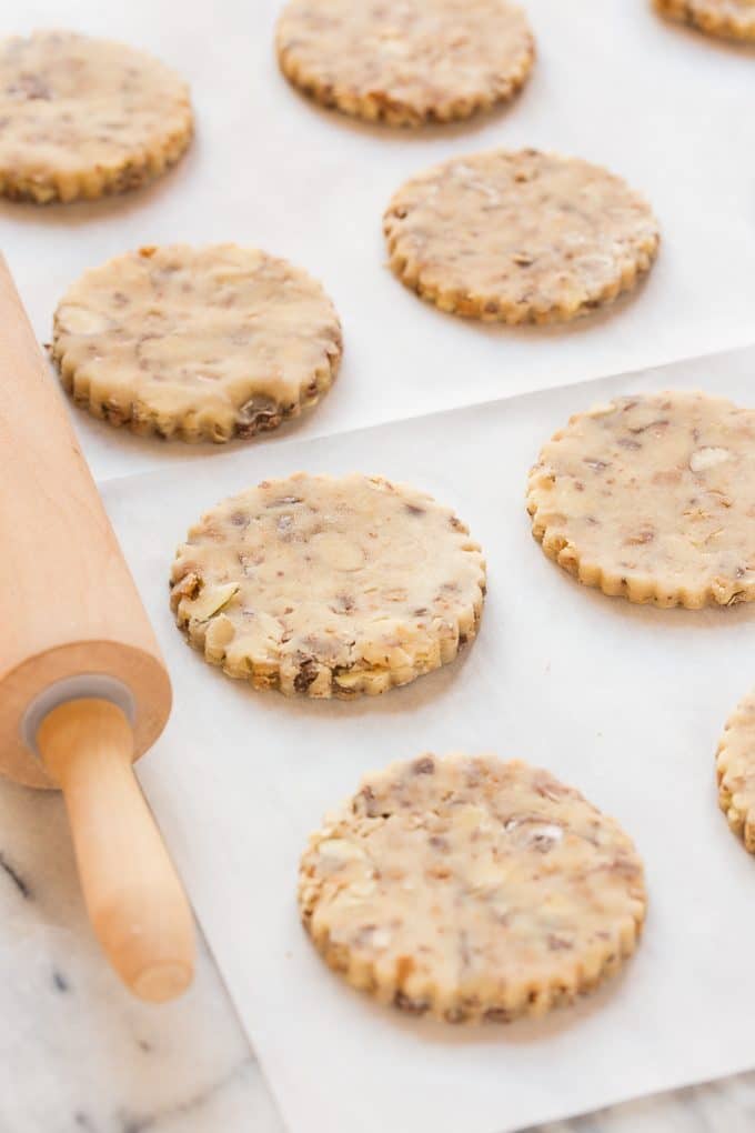 These almond roca cookies are loaded with toffee and almonds and topped with creamy milk chocolate. A unique offering that's perfect for the holidays!