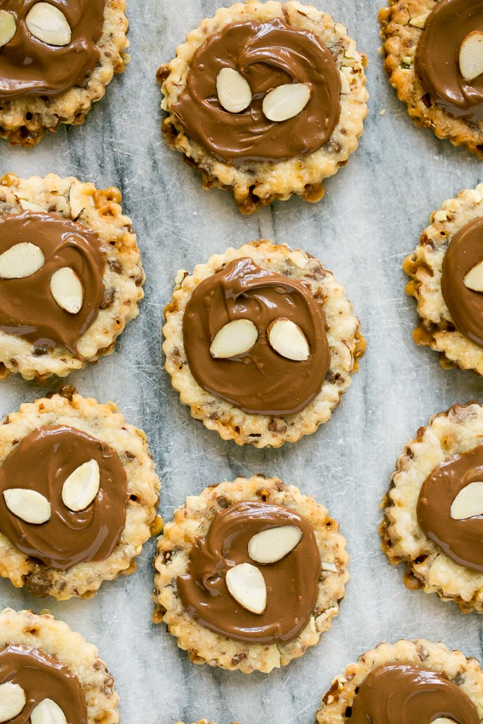 These almond roca cookies are loaded with toffee and almonds and topped with creamy milk chocolate. #BakeMagicMoments #Target ad