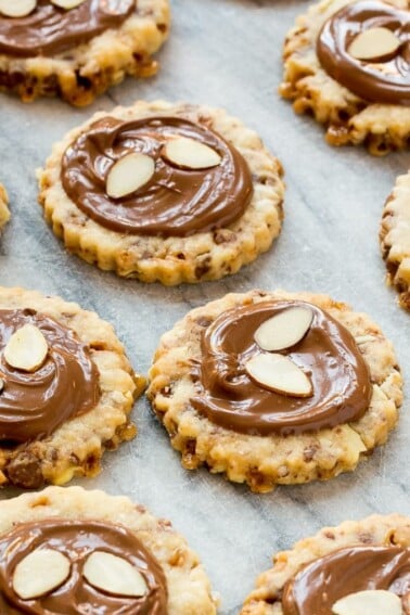 These almond roca cookies are loaded with toffee and almonds and topped with creamy milk chocolate. #BakeMagicMoments #Target ad