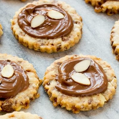 These almond roca cookies are loaded with toffee and almonds and topped with creamy milk chocolate. #BakeMagicMoments #Target ad