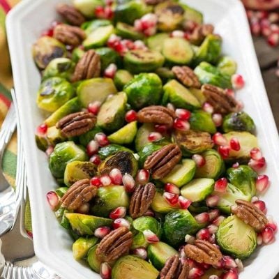 These pomegranate pecan brussels sprouts are a healthy and colorful side dish with just 5 ingredients and 5 minutes of prep time.