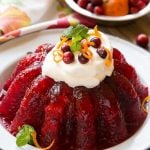 Raspberry gelatin is combined with cranberry sauce, pineapple and orange zest for a delicious side dish or dessert that's perfect for the holidays.