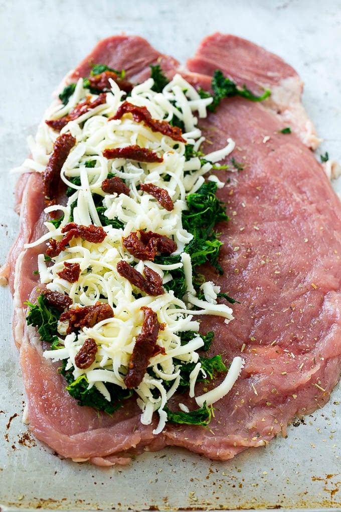 A butterflied pork tenderloin filled with spinach, sun dried tomatoes and mozzarella cheese.