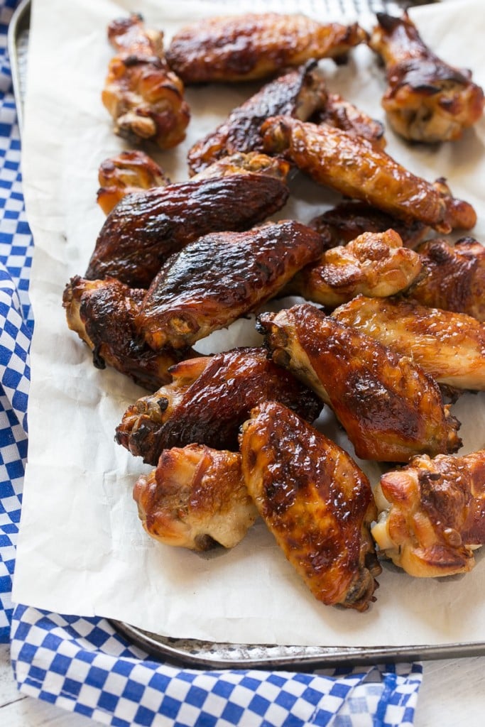 These sweet and tangy baked chicken wings are smothered in a homemade barbecue sauce. They’re extra crispy without any frying required!#OneOfAKindFan #ad