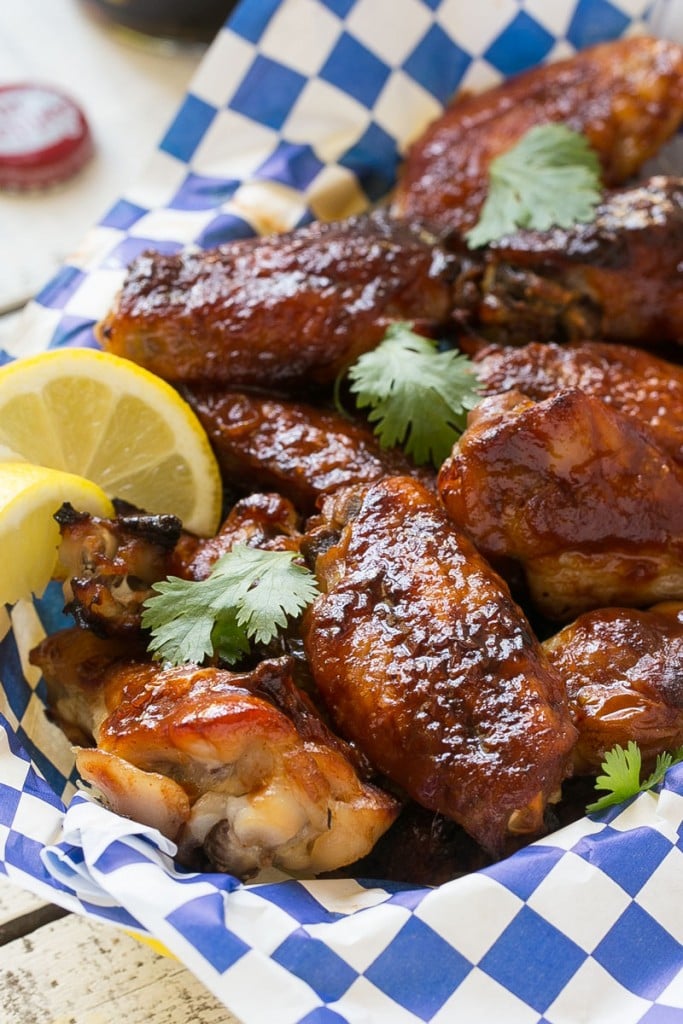 These sweet and tangy baked chicken wings are smothered in a homemade barbecue sauce. They’re extra crispy without any frying required! #OneOfAKindFan #ad