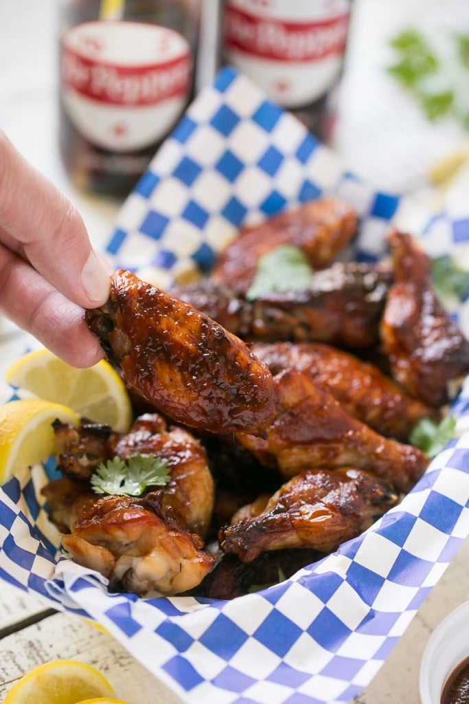 These sweet and tangy baked chicken wings are smothered in a homemade barbecue sauce. They’re extra crispy without any frying required!#OneOfAKindFan #ad