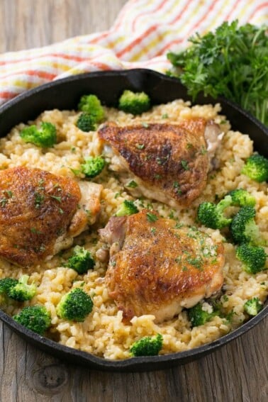 This one pot chicken with cheddar broccoli rice combines classic flavors for a quick and easy dinner. Chicken thighs are cooked with a creamy cheesy broccoli cheddar rice for a complete meal without all the cleanup.