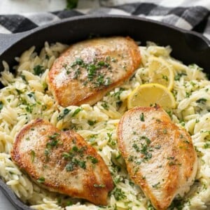 This one pot chicken with creamy spinach artichoke pasta is made with seared chicken breasts, orzo pasta, fresh spinach, artichokes and plenty of cheese. It's a quick and easy weeknight dinner with less dishes to do at the end!