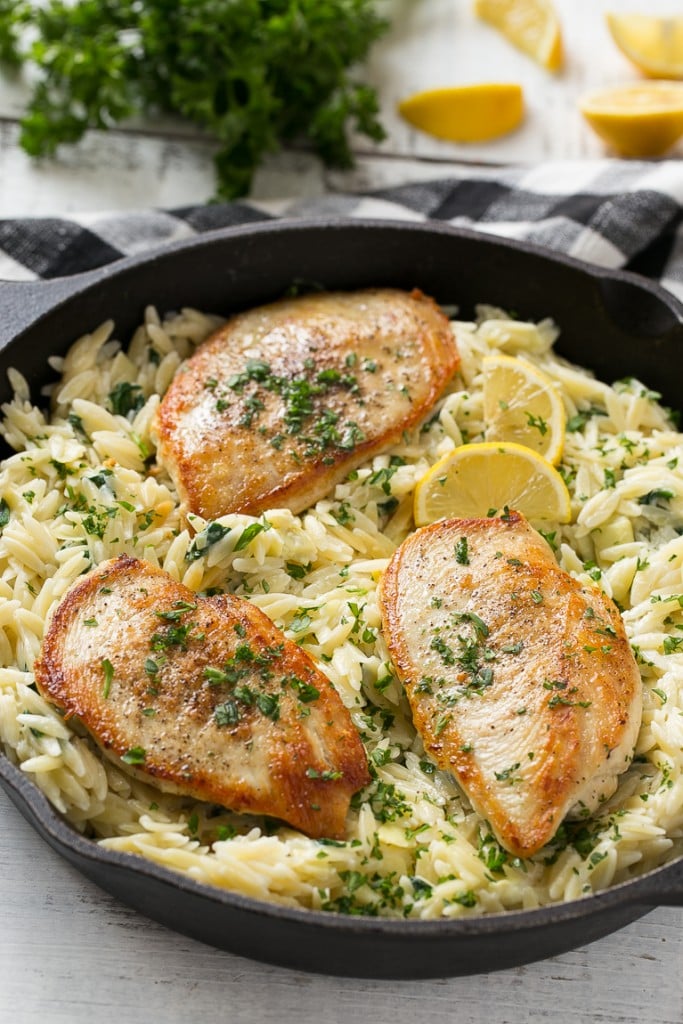 This one pot chicken with creamy spinach artichoke pasta is made with seared chicken breasts, orzo pasta, fresh spinach, artichokes and plenty of cheese. It's a quick and easy weeknight dinner with less dishes to do at the end!