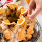 This cranberry orange pull apart monkey bread is balls of soft and tender dough coated in orange sugar and layered with dried cranberries, then baked to a golden brown. It's a lighter alternative to the traditional monkey bread. #BetterWithCraisins Ad