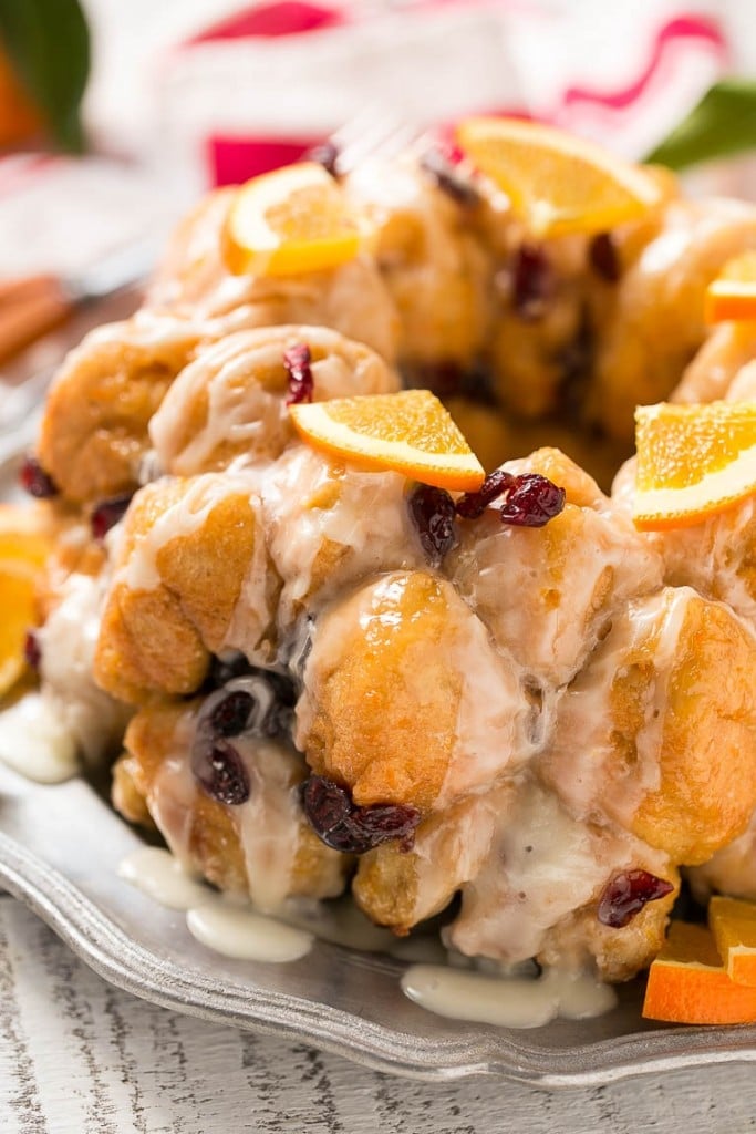 This cranberry orange pull apart monkey bread is balls of soft and tender dough coated in orange sugar and layered with dried cranberries, then baked to a golden brown. It's a lighter alternative to the traditional monkey bread. #BetterWithCraisins Ad